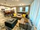 Open concept living room and kitchen with modern decor at 2178 Cooper Bell Pl, Kissimmee, FL 34747