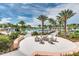 Community pool with fire pit and lounge seating at 2178 Cooper Bell Pl, Kissimmee, FL 34747