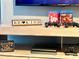 Entertainment center with gaming consoles and games at 2178 Cooper Bell Pl, Kissimmee, FL 34747