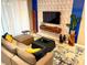 Modern living room with sectional sofa and accent pillows at 2178 Cooper Bell Pl, Kissimmee, FL 34747