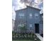 Two-story home with gray siding and stone accents at 2178 Cooper Bell Pl, Kissimmee, FL 34747