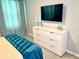 Bedroom with dresser and mounted TV at 2178 Cooper Bell Pl, Kissimmee, FL 34747