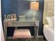 Elegant vanity with mirrored accents and a comfortable stool at 2178 Cooper Bell Pl, Kissimmee, FL 34747