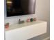 Modern white TV stand with decorative accents at 2178 Cooper Bell Pl, Kissimmee, FL 34747