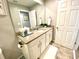 Modern bathroom with vanity and a large mirror at 2178 Cooper Bell Pl, Kissimmee, FL 34747