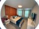 Bedroom with full bed and wood accent wall at 2178 Cooper Bell Pl, Kissimmee, FL 34747
