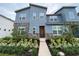 Two-story home with modern facade and landscaped front yard at 2178 Cooper Bell Pl, Kissimmee, FL 34747