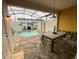Private screened-in pool area with outdoor dining at 2178 Cooper Bell Pl, Kissimmee, FL 34747