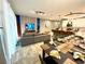Bright dining area with a large wooden table and modern pendant lighting at 2178 Cooper Bell Pl, Kissimmee, FL 34747