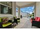 Relaxing screened patio with seating area overlooking the pool at 8984 Stinger Dr, Champions Gate, FL 33896