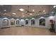 Bright fitness center with wood floors, mirrors, and exercise equipment at 8984 Stinger Dr, Champions Gate, FL 33896