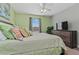 Bedroom with large bed, TV, and dresser at 8984 Stinger Dr, Champions Gate, FL 33896