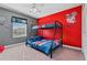 bedroom with bunk bed, Mickey Mouse wall, and window at 8984 Stinger Dr, Champions Gate, FL 33896
