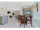 Bright dining area with a table and chairs, open to the living room at 8984 Stinger Dr, Champions Gate, FL 33896