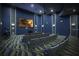 Community theater room with comfortable seating at 8984 Stinger Dr, Champions Gate, FL 33896