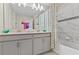 Bathroom with double vanity and bathtub at 8984 Stinger Dr, Champions Gate, FL 33896