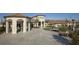 Elegant community clubhouse with fountain and outdoor seating at 8984 Stinger Dr, Champions Gate, FL 33896