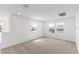 Bright bedroom with two windows and carpet at 1128 Griffon Ave, Lake Alfred, FL 33850