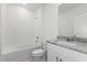 Clean bathroom, granite countertop, and bathtub at 1128 Griffon Ave, Lake Alfred, FL 33850
