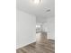 Clean and bright hallway with wood-look flooring at 1128 Griffon Ave, Lake Alfred, FL 33850