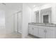 Bathroom with double vanity and shower at 1128 Griffon Ave, Lake Alfred, FL 33850