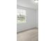 Simple bedroom with carpeted floor and window at 1128 Griffon Ave, Lake Alfred, FL 33850