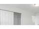 Bright bedroom with spacious closet and sliding doors at 1128 Griffon Ave, Lake Alfred, FL 33850