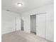 Bright bedroom with double door closet and access to another room at 1128 Griffon Ave, Lake Alfred, FL 33850