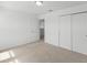 Bedroom with double door closet and carpet at 1128 Griffon Ave, Lake Alfred, FL 33850