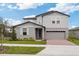 Two story house with light gray siding and blue shutters at 1128 Griffon Ave, Lake Alfred, FL 33850