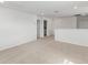 Spacious bedroom with carpet and access to bathroom at 1128 Griffon Ave, Lake Alfred, FL 33850
