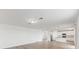 Spacious living room with an open floor plan and kitchen view at 1128 Griffon Ave, Lake Alfred, FL 33850