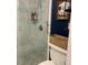 Updated shower with marble tile and glass enclosure at 5831 Bassett Ave, Orlando, FL 32833