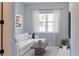 Bright Gathering room featuring an L-shaped sofa and large window at 16829 Bolsena Dr, Montverde, FL 34756