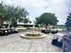 Resort-style entrance with fountain and golf carts at 16829 Bolsena Dr, Montverde, FL 34756