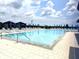 Inviting resort-style pool with ample lounge chairs at 16829 Bolsena Dr, Montverde, FL 34756