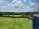 Stunning view of a lake and golf course from backyard at 16829 Bolsena Dr, Montverde, FL 34756