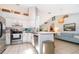 Modern kitchen with stainless steel appliances and island at 132 Robbins Rest Cir, Davenport, FL 33896