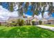 Single-story house with gray garage and basketball hoop at 132 Robbins Rest Cir, Davenport, FL 33896