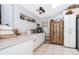 White kitchen with wood cabinets and functional layout at 132 Robbins Rest Cir, Davenport, FL 33896