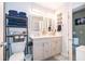 Updated bathroom with double vanity and modern fixtures at 132 Robbins Rest Cir, Davenport, FL 33896