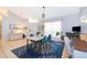 Open concept dining area featuring a modern table and chairs at 132 Robbins Rest Cir, Davenport, FL 33896