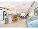 Modern kitchen with stainless steel appliances and breakfast bar at 132 Robbins Rest Cir, Davenport, FL 33896