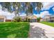 Single-story house with gray garage and basketball hoop at 132 Robbins Rest Cir, Davenport, FL 33896