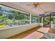 Bright screened porch overlooks the backyard with ample natural light at 191 E Ponkan Rd, Apopka, FL 32712
