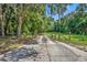 Long private driveway leading to a secluded property at 191 E Ponkan Rd, Apopka, FL 32712