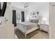 Bright bedroom with king-size bed and modern nightstands at 2211 San Vittorino Cir # 105, Kissimmee, FL 34741