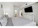 Spacious bedroom with a king-size bed, dresser, and view of the kitchen at 2211 San Vittorino Cir # 105, Kissimmee, FL 34741