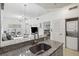 Kitchen with granite countertops and a view into living room at 2211 San Vittorino Cir # 105, Kissimmee, FL 34741