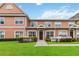 Attractive two-story townhome with a well-manicured lawn and white picket fence at 2211 San Vittorino Cir # 105, Kissimmee, FL 34741